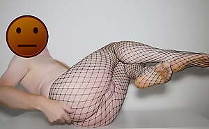 Posing and stripping off black fishnet pantyhose tights
