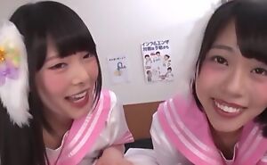 Two smiley Oriental girls suck eyeless throbbing cock in POV