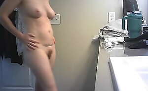 Naked MILF unaware on hidden cam putting on lotion after shower - please comment