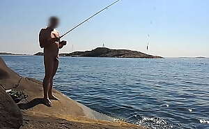 Naked public fishing on the nude beach