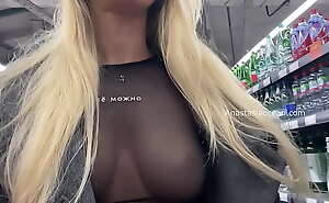 Without underwear. Showing breasts in public at the supermarket