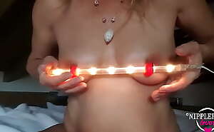 nippleringlover hot mom inserting 17mm light tube through extreme stretched nipple piercings red see through nipples