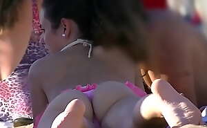 Hot bitch at the beach with pink thong