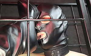 The slave is in a cage. A Dominatrix Nika with beautiful slender legs puts her legs in a cage to a slave so that he licks her boots clean. The slave tries hard, sucks the heel and licks the soles of the boots