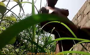 Ebony latina in the middle of the grass