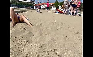 Wife exposes Pussy beneath panties on a public beach