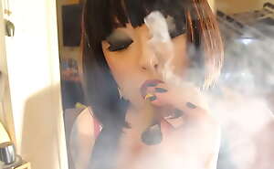 BBW Mistress Tina Snua Smokes A Cigar Showing Off Cleavage